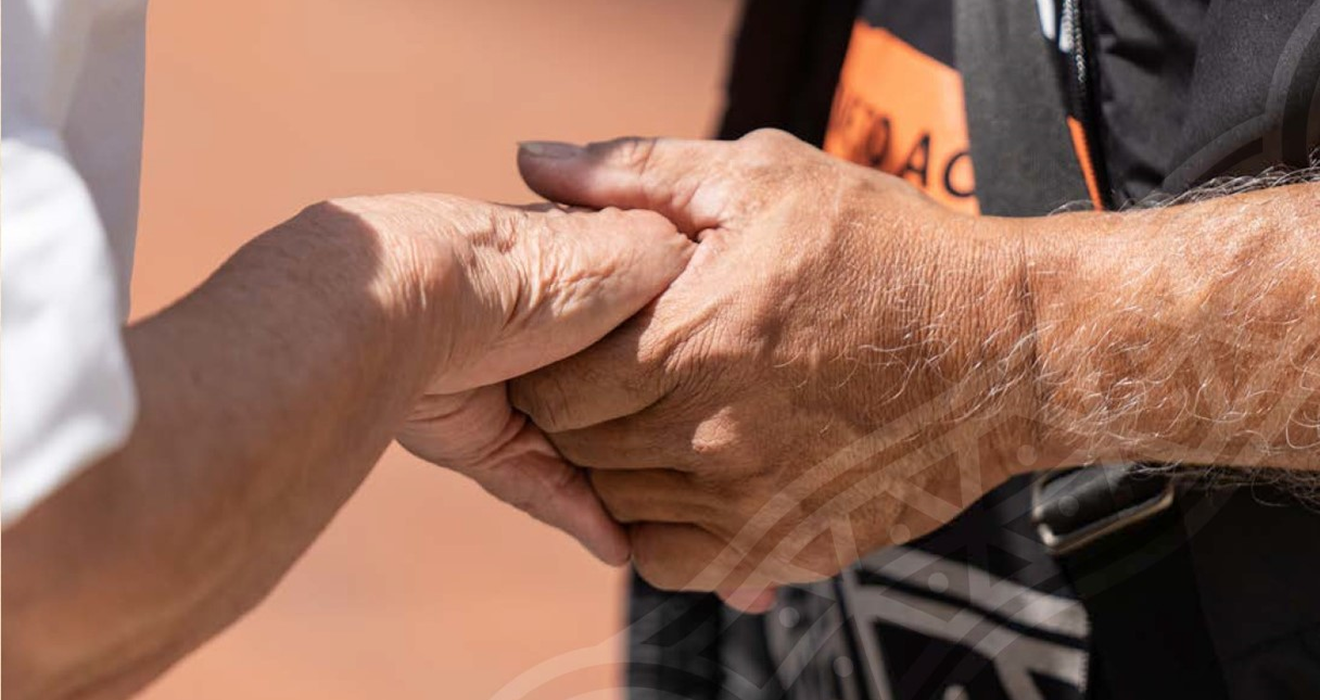 Two people holding hands